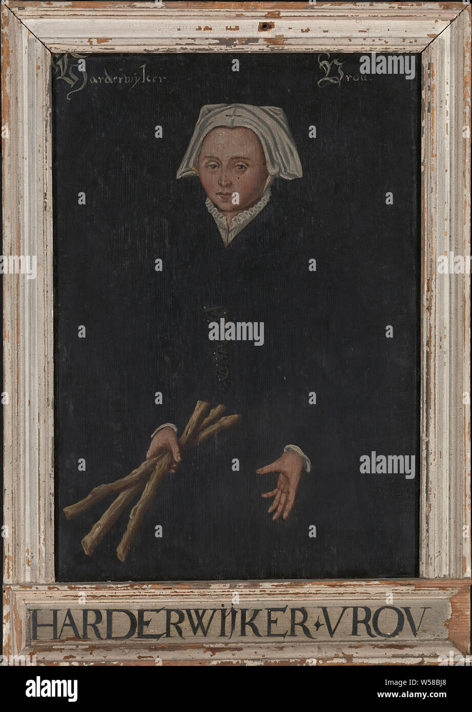 Harderwijker Vrou, vieille peinture d'une dame tenant trois bâtons en bois, cadre photo, h 52,7 cm × 32,1 cm × W H 2,7 cm l 42,1 cm × d 29,4 cm, huile sur toile, ca. 16e siècle Banque D'Images