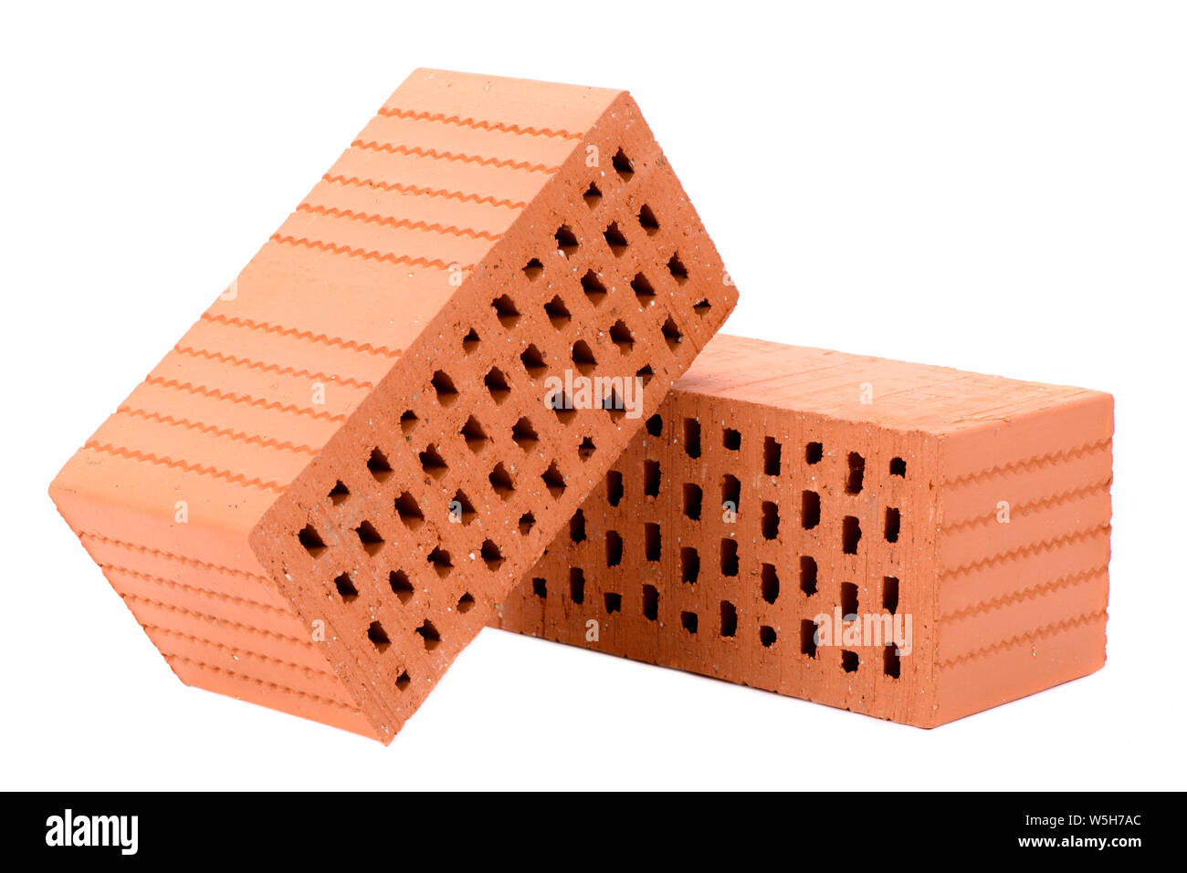 Symboloic briques empilées pour maison en construction Banque D'Images