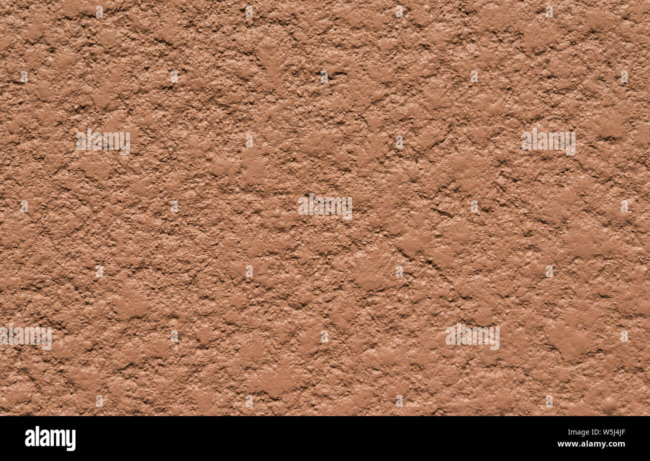 Brown mur de béton avec surface rugueuse comme arrière-plan Banque D'Images