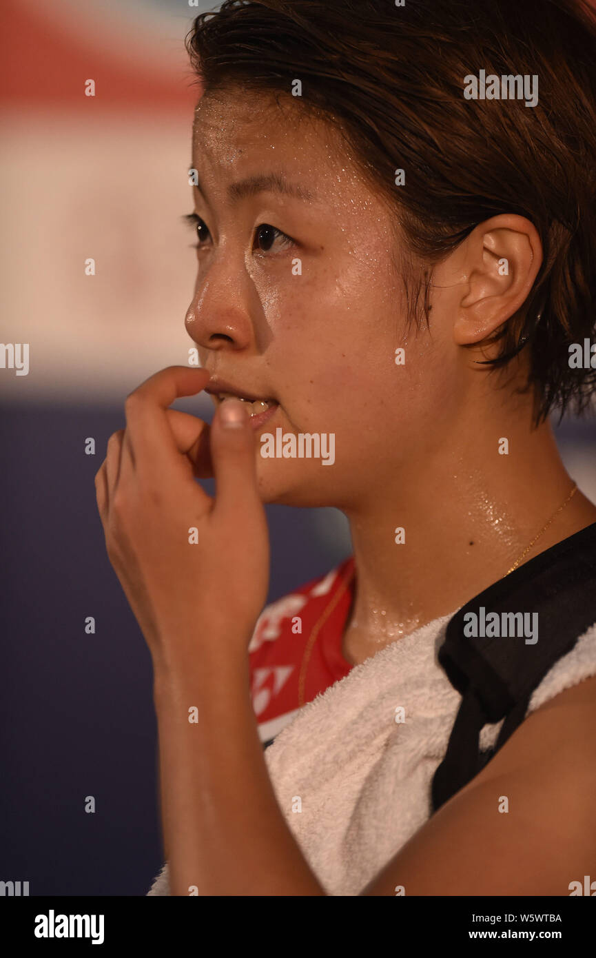 Nozomi Okuhara du Japon est en concurrence avec Pornpawee Chochuwong de la Thaïlande dans leur quart de finale du simple dames au cours de la-YONEX SUNRISE Député Banque D'Images