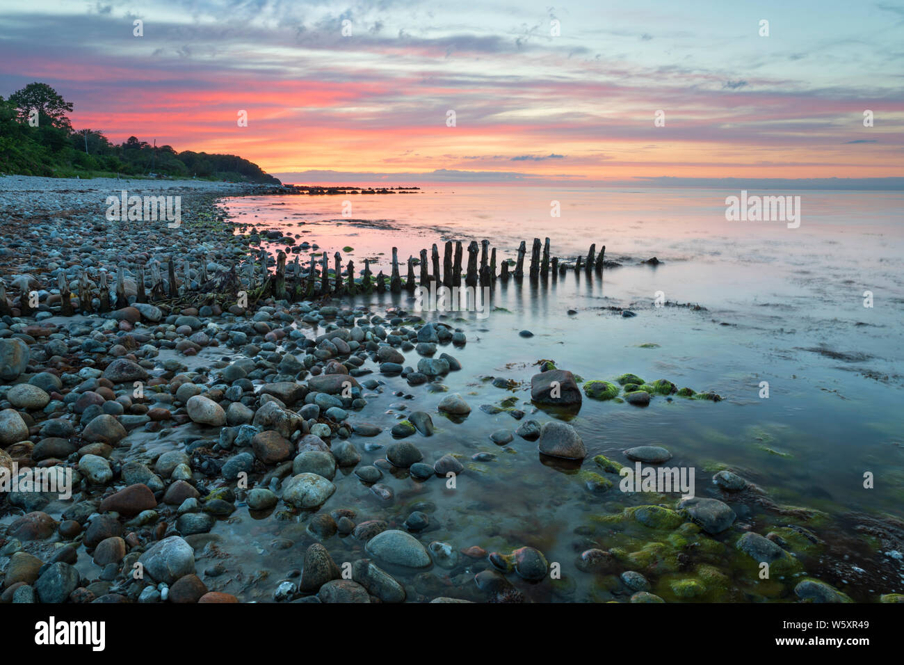 Coucher de soleil sur Munkerup beach, Munkerup, Région Hovedstaden, la Nouvelle-Zélande, le Danemark, Europe Banque D'Images