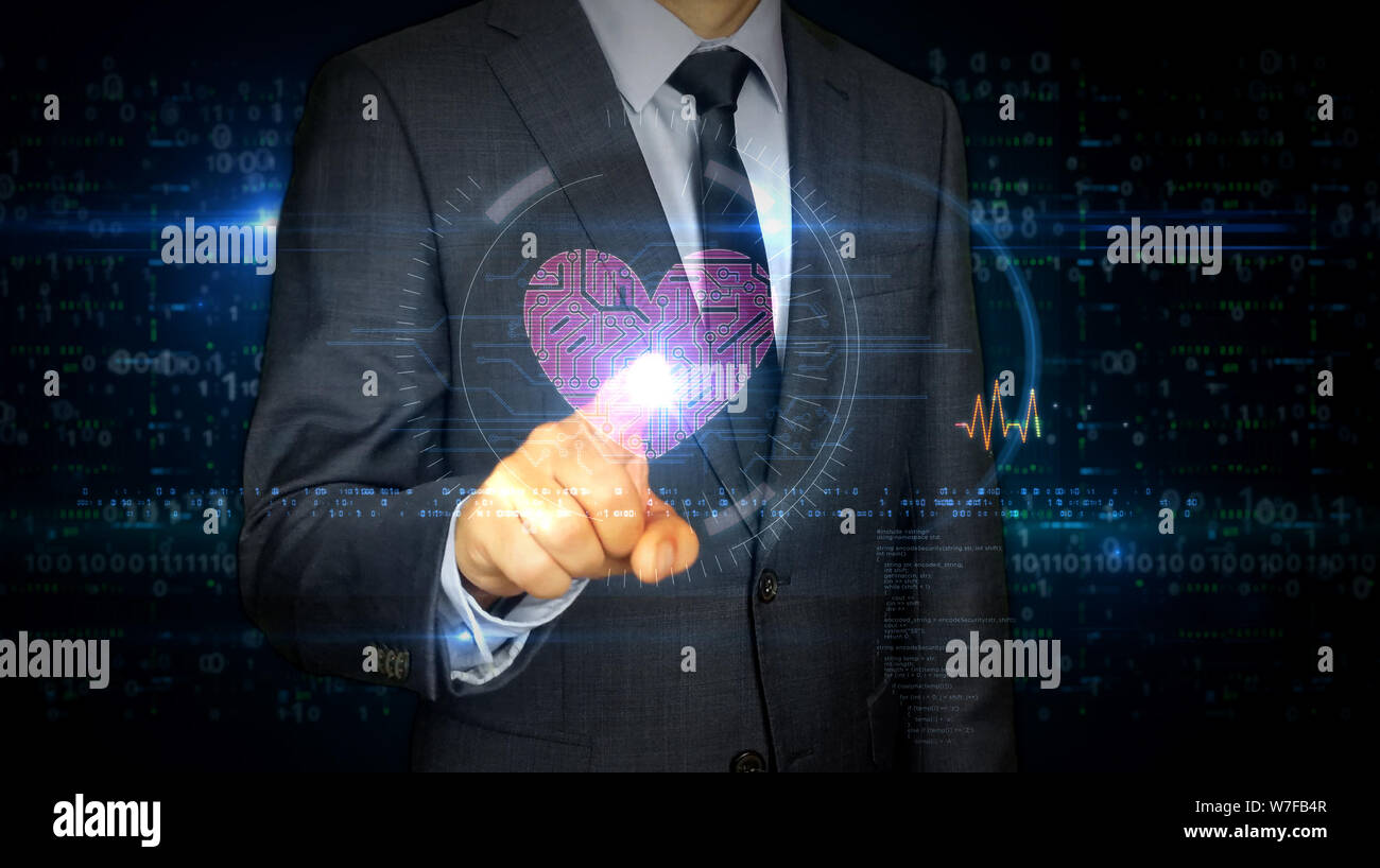 Businessman en costume de toucher l'écran avec le symbole du cœur cybernétique hologramme. L'homme à l'aide de main sur l'écran virtuel. L'amour, cyber dating, romantique, la santé Banque D'Images