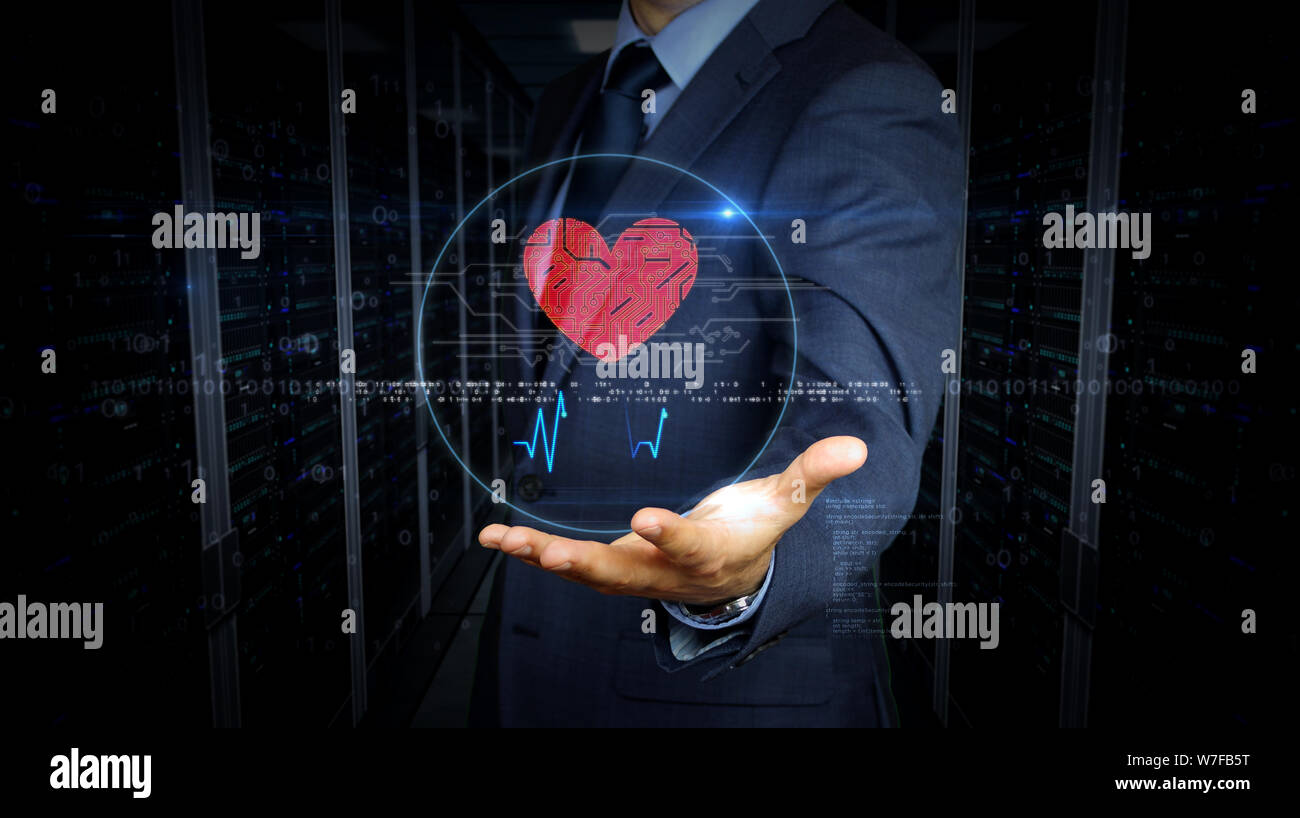 Businessman en costume de toucher l'écran avec le symbole du cœur cybernétique hologramme. L'homme à l'aide de main sur l'écran virtuel. L'amour, cyber dating, romantique, la santé Banque D'Images