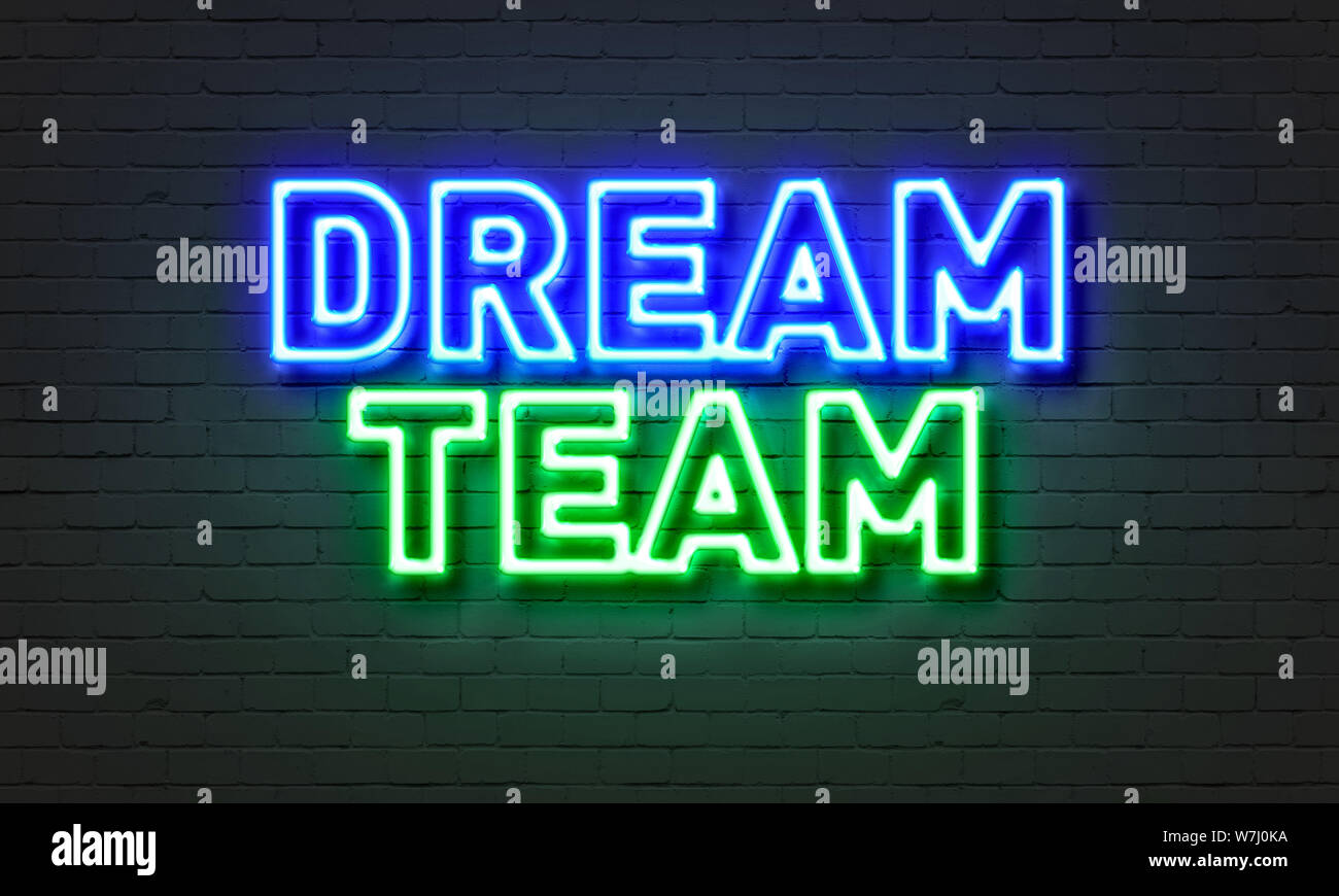 Une équipe de rêve en néon sur fond brique Banque D'Images
