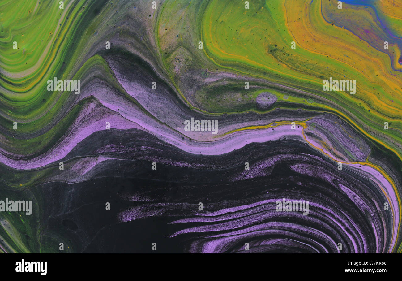 Résumé Contexte L'effet marbré. violet, vert et noir couleurs créatives Banque D'Images