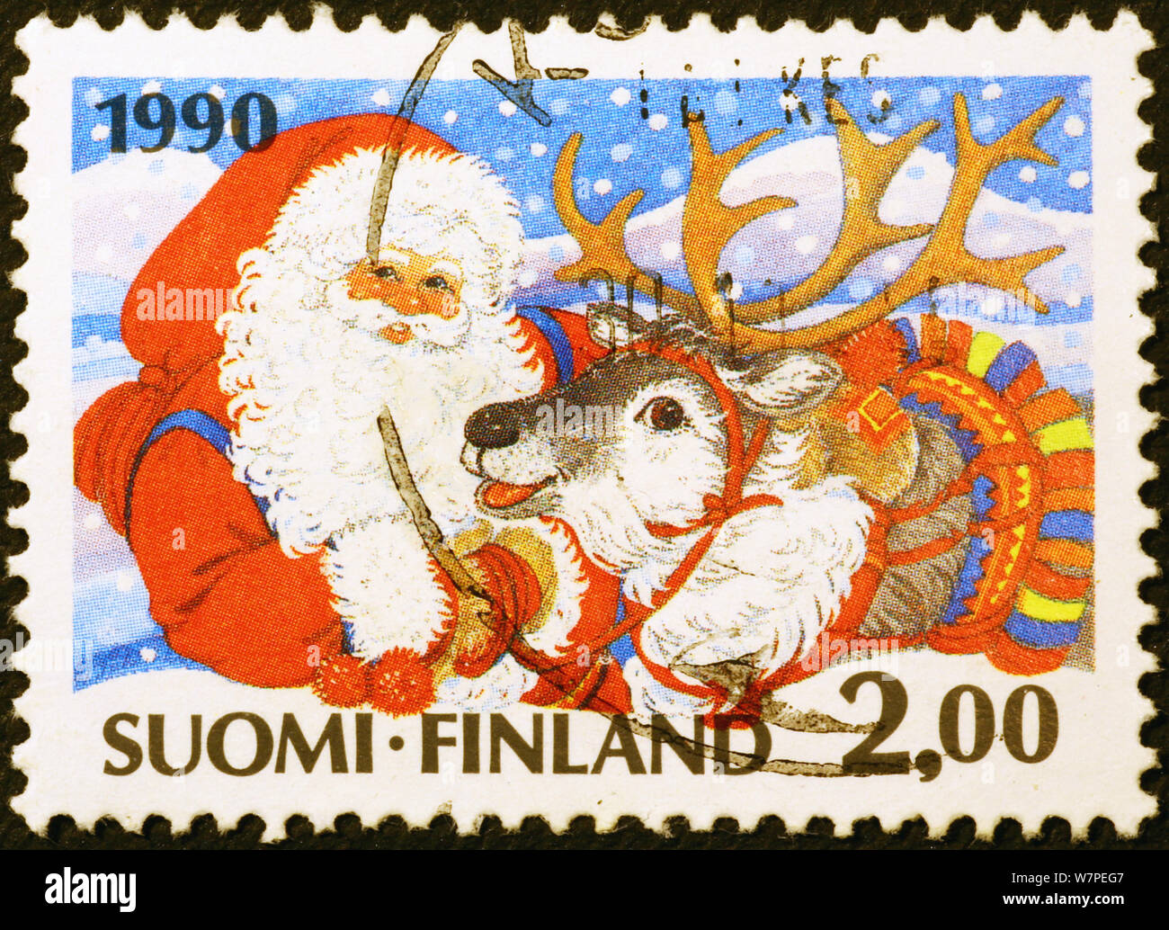 Le Père Noël et renne sur timbre finlandais Banque D'Images