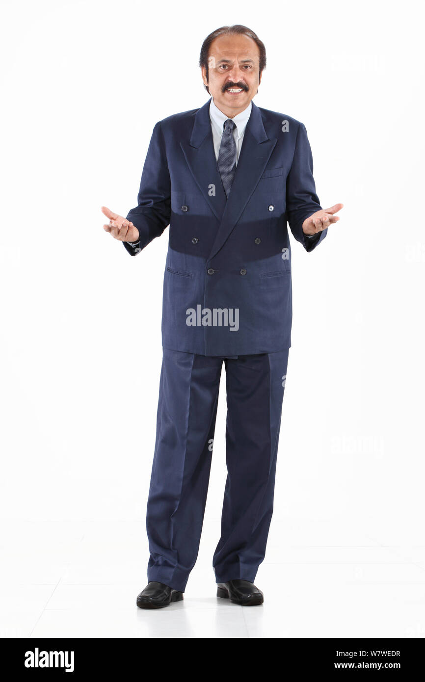 Businessman standing and gesturing Banque D'Images