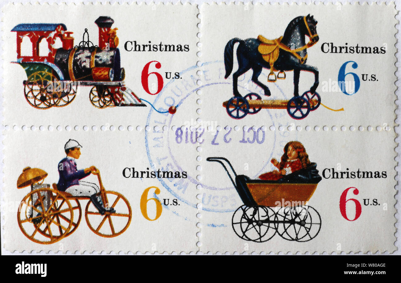 Vieux jouets sur quatre timbres de Noël américains Banque D'Images