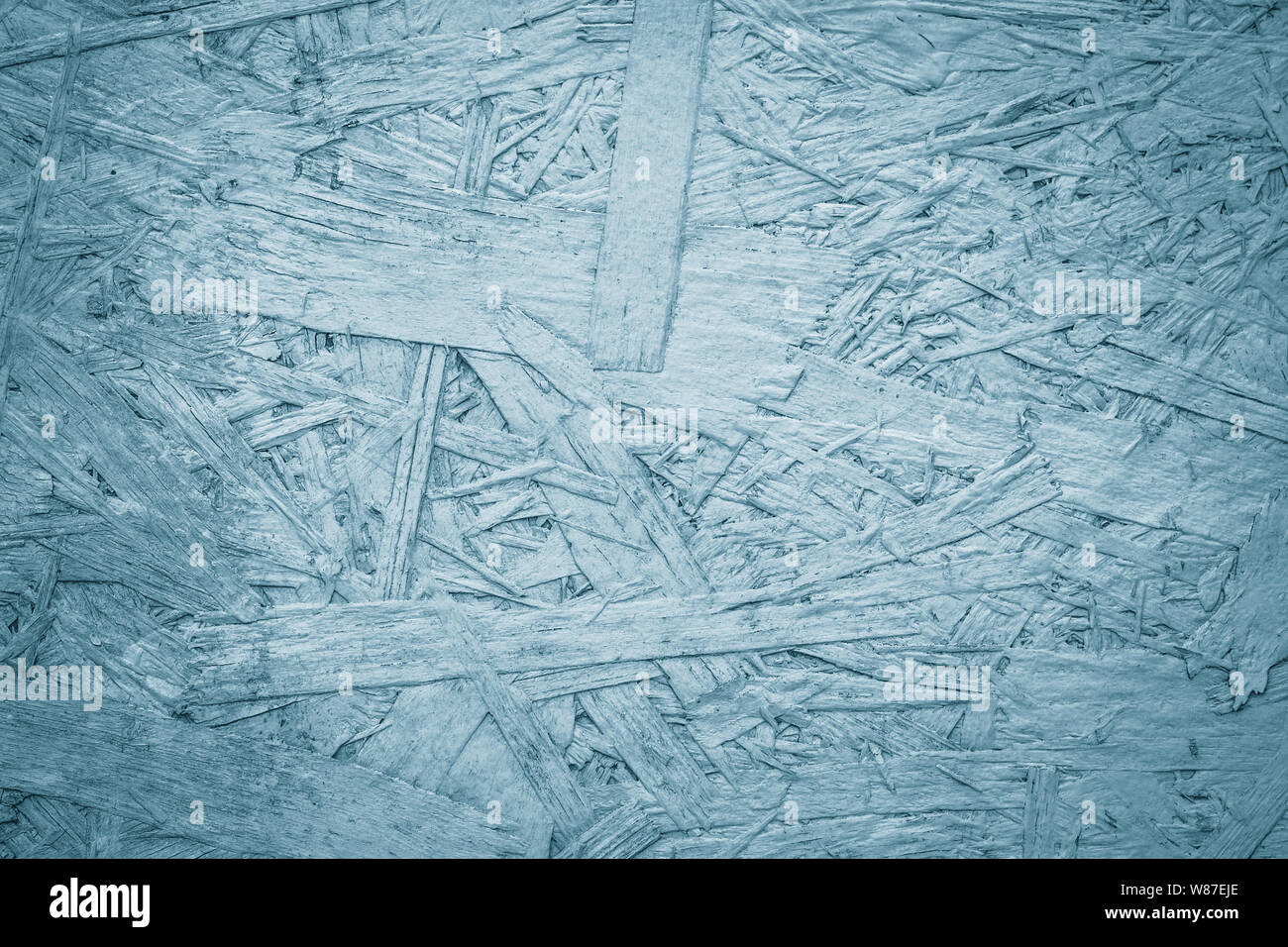 Copeaux de bois, de texture fines lamelles arrière-plan. Contreplaqué, OSB. Dépôts, surface du contreplaqué. Bleu et gris clair de la dalle. Banque D'Images