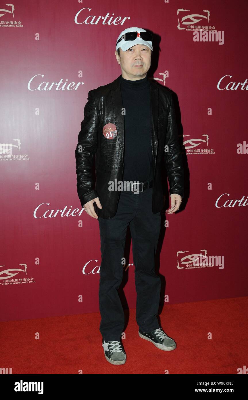 Légende du rock chinois Cui Jian pose sur le tapis rouge, comme il arrive pour la désignation d'un banquet de l'administration de la China Film 2013 Cérémonie de remise des prix Guide i Banque D'Images