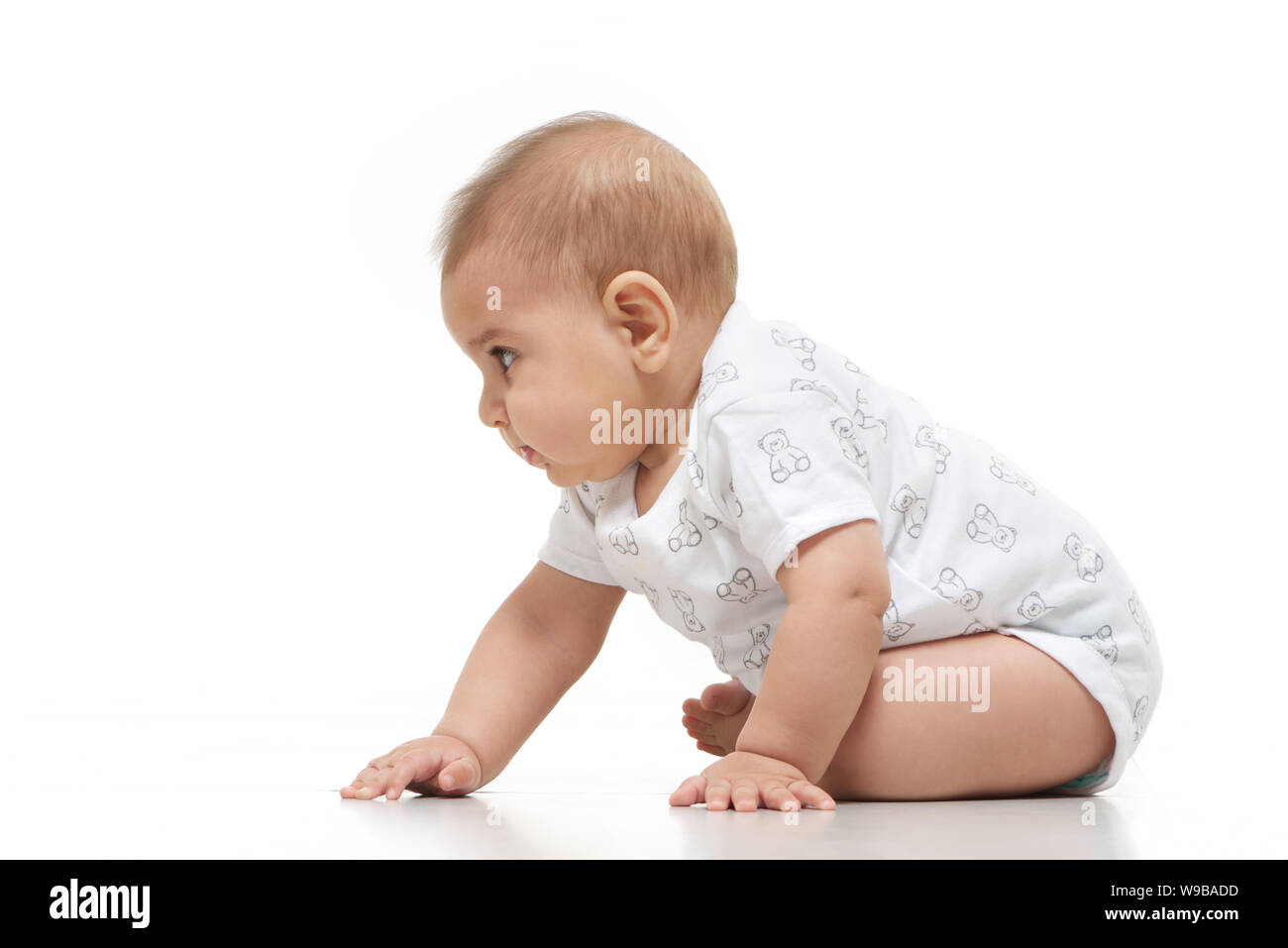 Baby Boy sitting on floor Banque D'Images