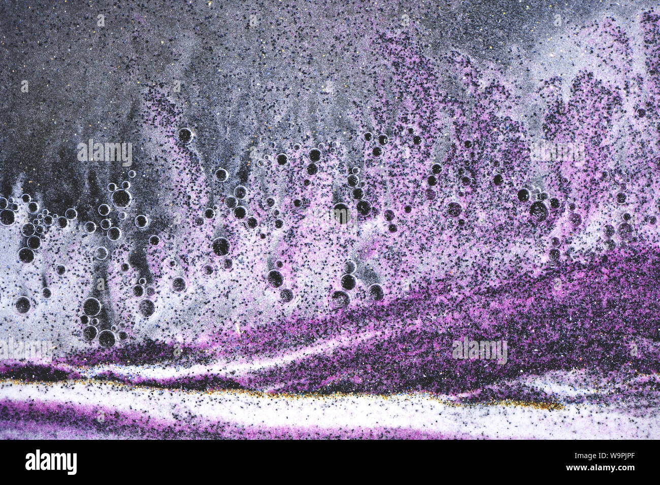 Abstrait art fond avec du sable coloré et liquide. Liquid art Banque D'Images