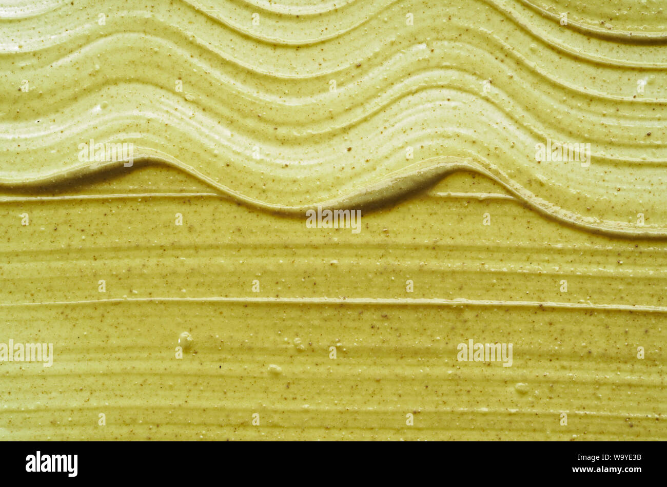 La texture et traits d'un vert clair pour masque bio visage ou corps isolé sur fond blanc Banque D'Images