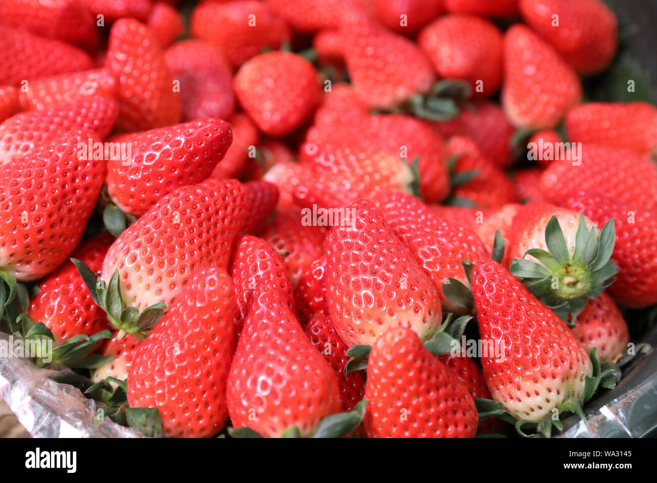 Un tas de fraises Banque D'Images