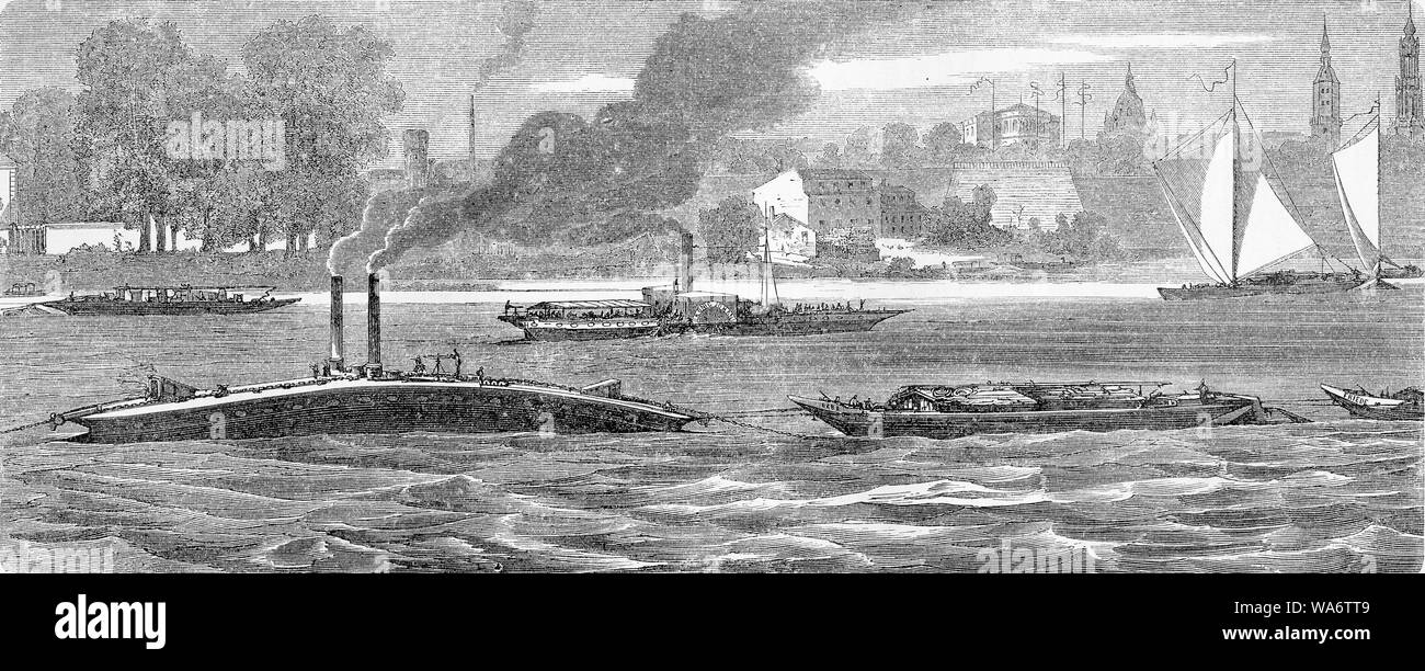 Le trafic fluvial sur l'Elbe près de Dresde : un remorqueur de sauvetage en tirant une buire et un bateau à vapeur avec sidewheels Banque D'Images