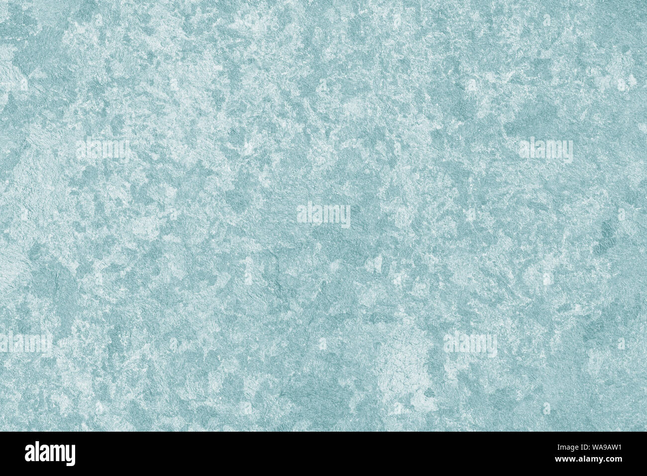 Mur en béton texturé vert clair. Mur Gris de stuc. Abstract pattern avec des taches gris de peinture sur la surface. Banque D'Images