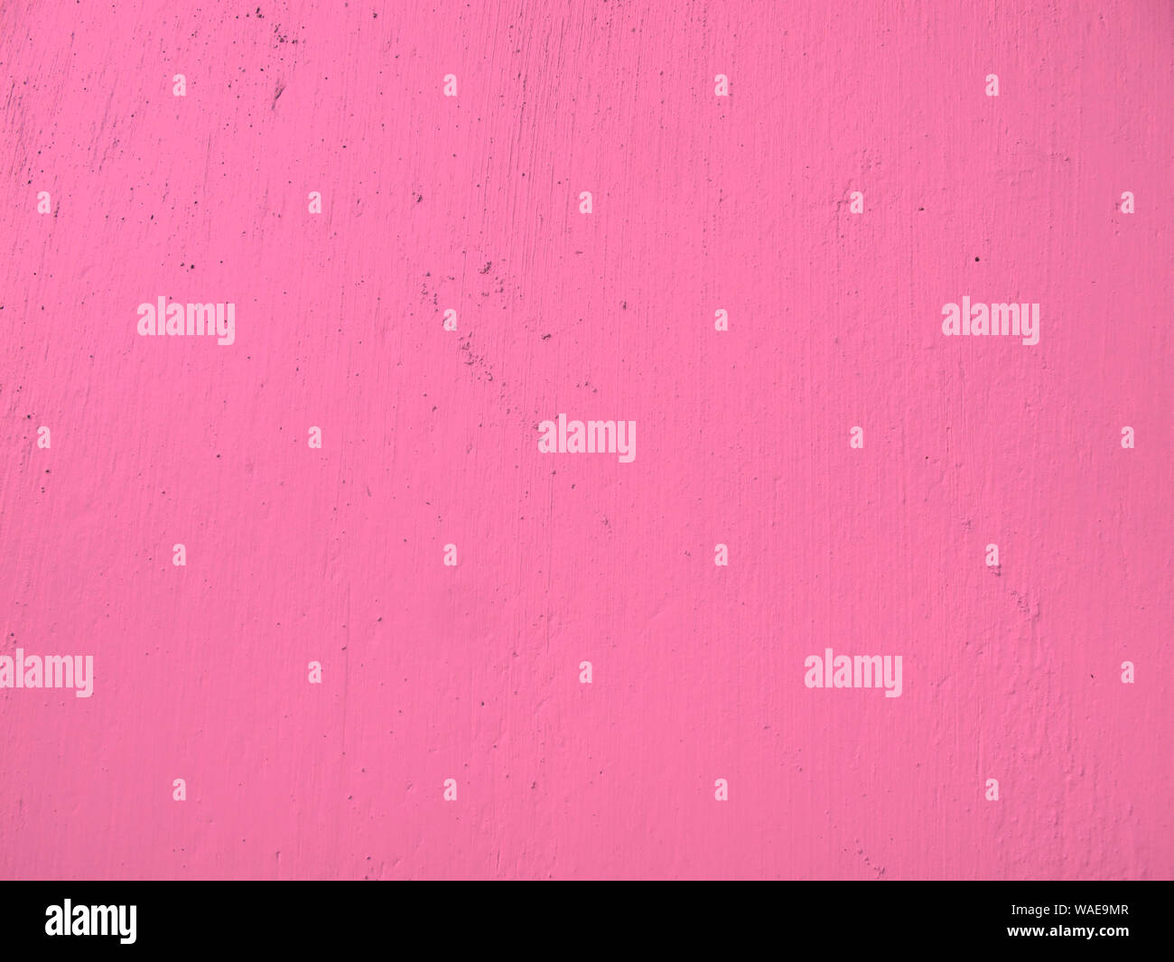 La texture de matériau des murs de ciment, peint en rose Banque D'Images