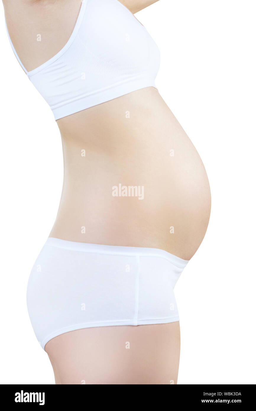 Vue latérale sur la femme enceinte avec le ventre en début de grossesse en  blanc sous-vêtements. Concept de la maternité. Isolé sur blanc Photo Stock  - Alamy