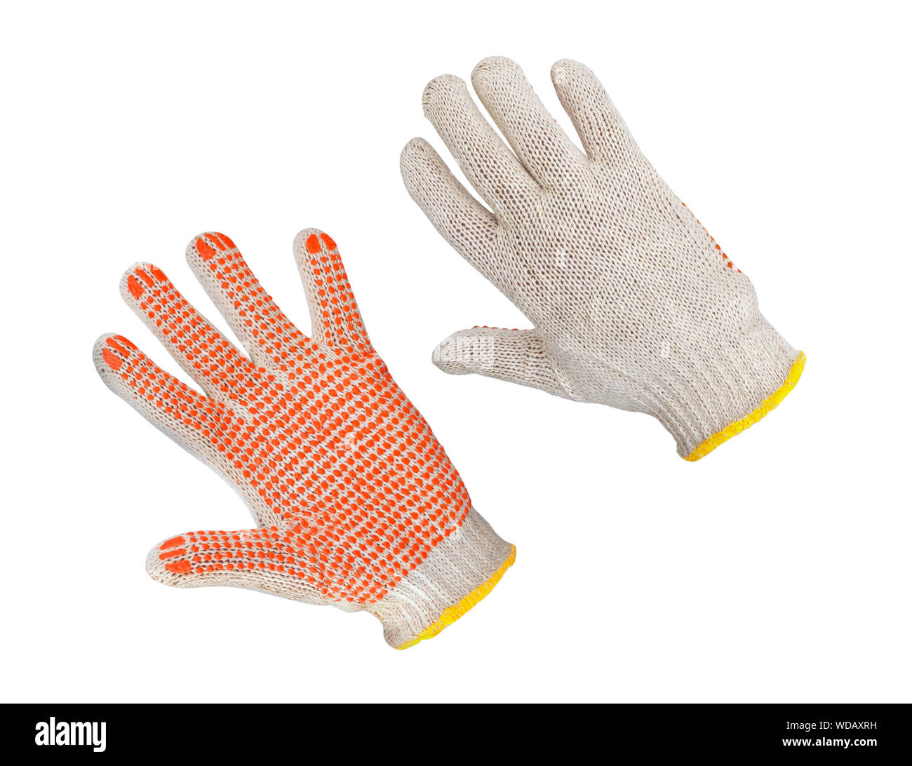 Gants en coton avec caoutchouc orange sur fond blanc. Gants de sécurité isolé sur fond blanc. Gants de protection travailleur Banque D'Images