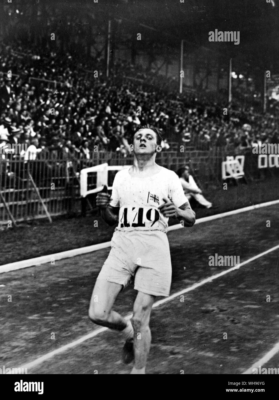 France, Paris, Jeux Olympiques 1924 : Ernest Harper (Grande-Bretagne) est entrée dans le quatrième 10 000 mètres.. Banque D'Images