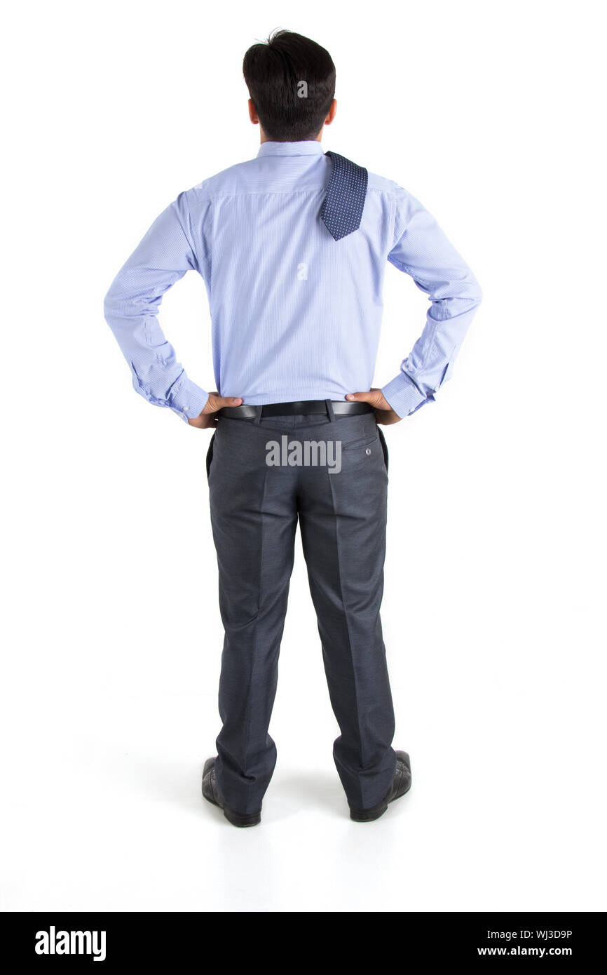 Vue arrière d'un businessman standing avec ses bras akimbo Banque D'Images