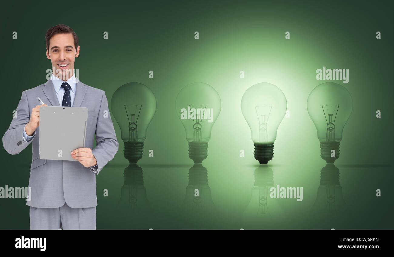 Composite image of businessman holding a clipboard Banque D'Images