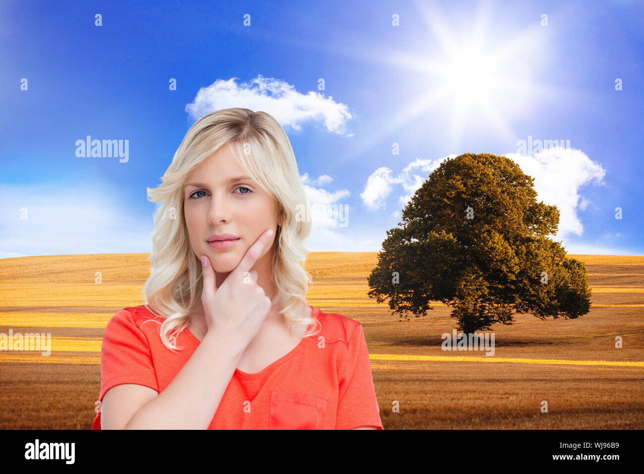 Image composite de l'adolescent debout pensivement avec ses doigts sur son menton Banque D'Images