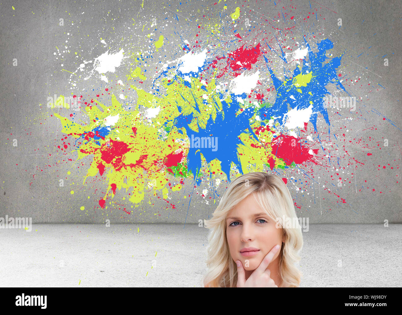 Image composite de l'adolescent debout pensivement avec ses doigts sur son menton Banque D'Images