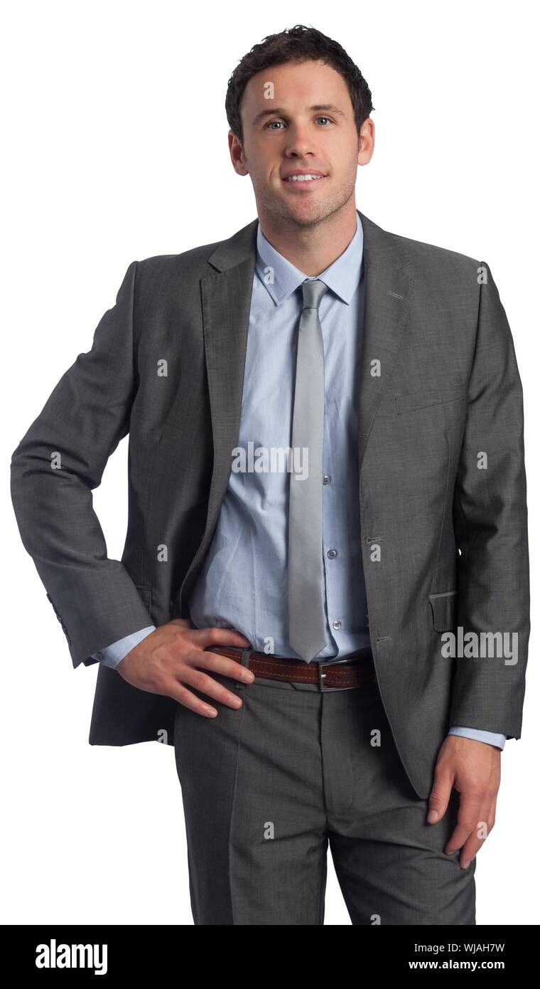 Smiling businessman with hand on hip Banque D'Images