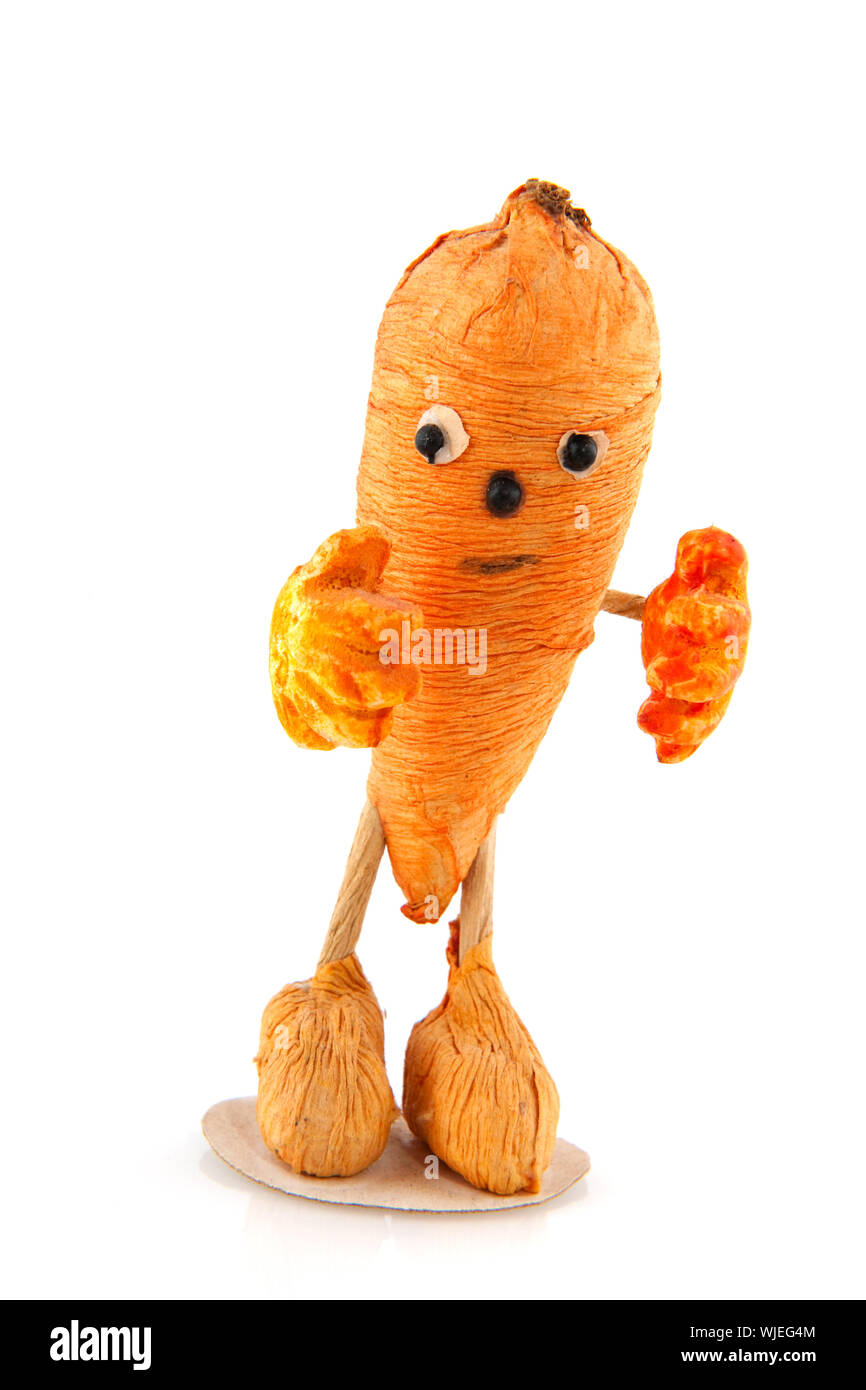 Drôle de carotte légumes avec mains et pieds Visage Banque D'Images