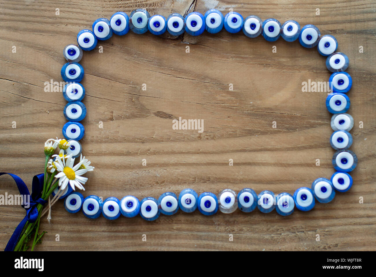 Mauvais œil bleu Fleur et châssis Banque D'Images