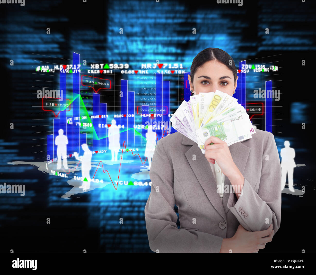 Young businesswoman cachant son visage derrière des billets de banque à l'encontre de textes flous bleu Banque D'Images