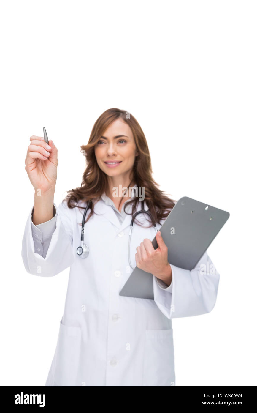 Doctor holding clipboard and pointing at something Banque D'Images