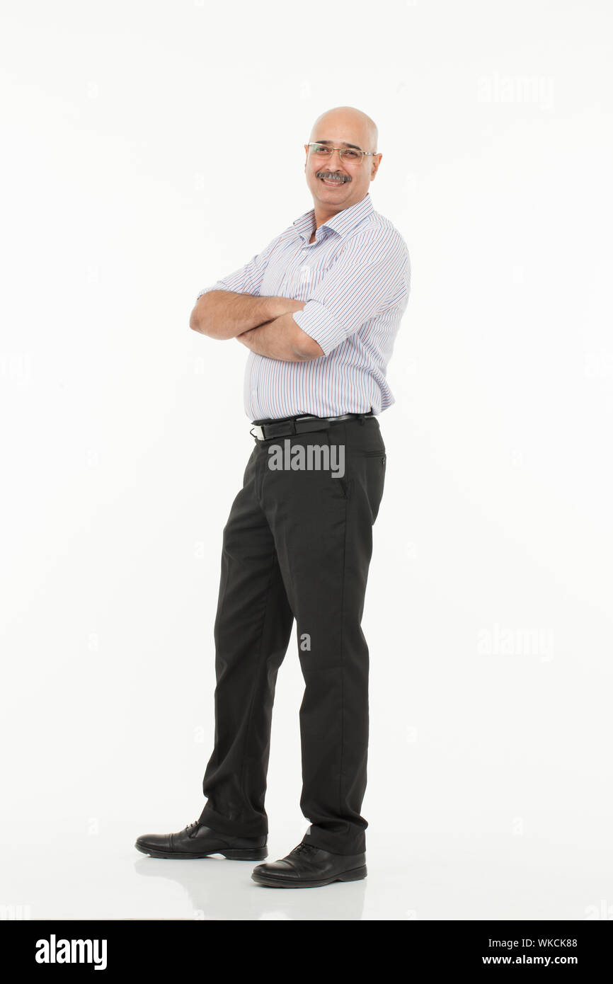 Businessman standing with his arms crossed Banque D'Images
