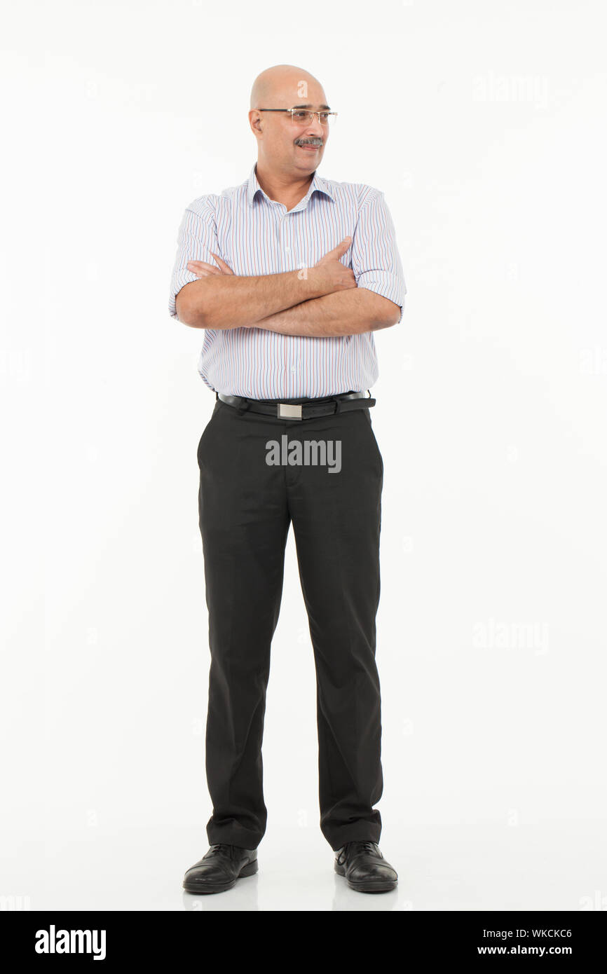 Businessman standing with his arms crossed Banque D'Images