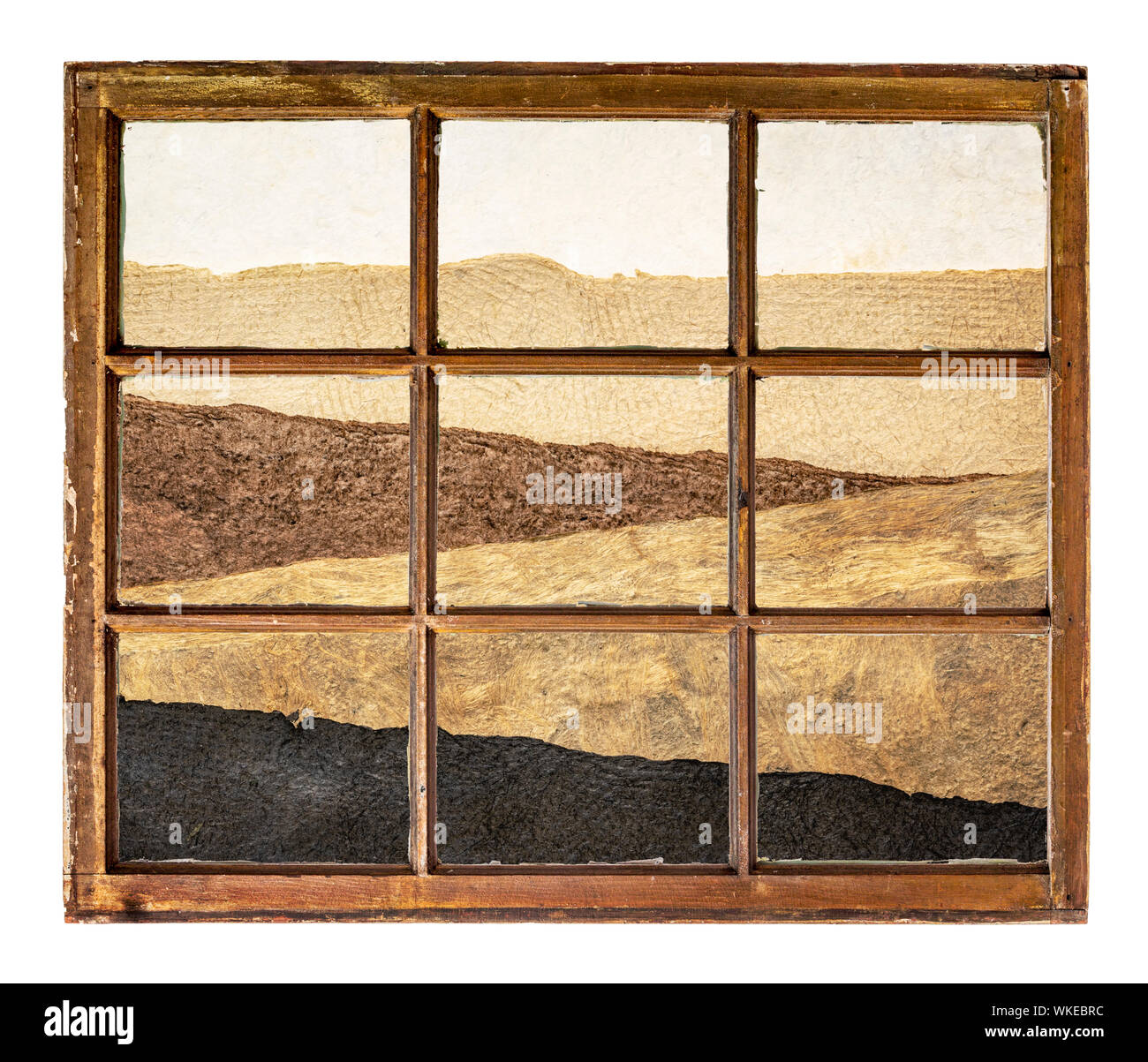 Abstract désert paysage créé avec des feuilles de papier rugueux comme vu à travers une fenêtre à guillotine vintage Banque D'Images