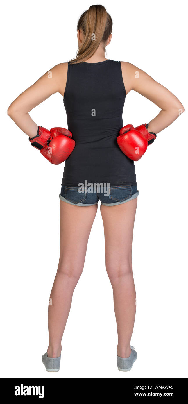 Woman in boxing gloves article akimbo. Isolé sur fond blanc Banque D'Images