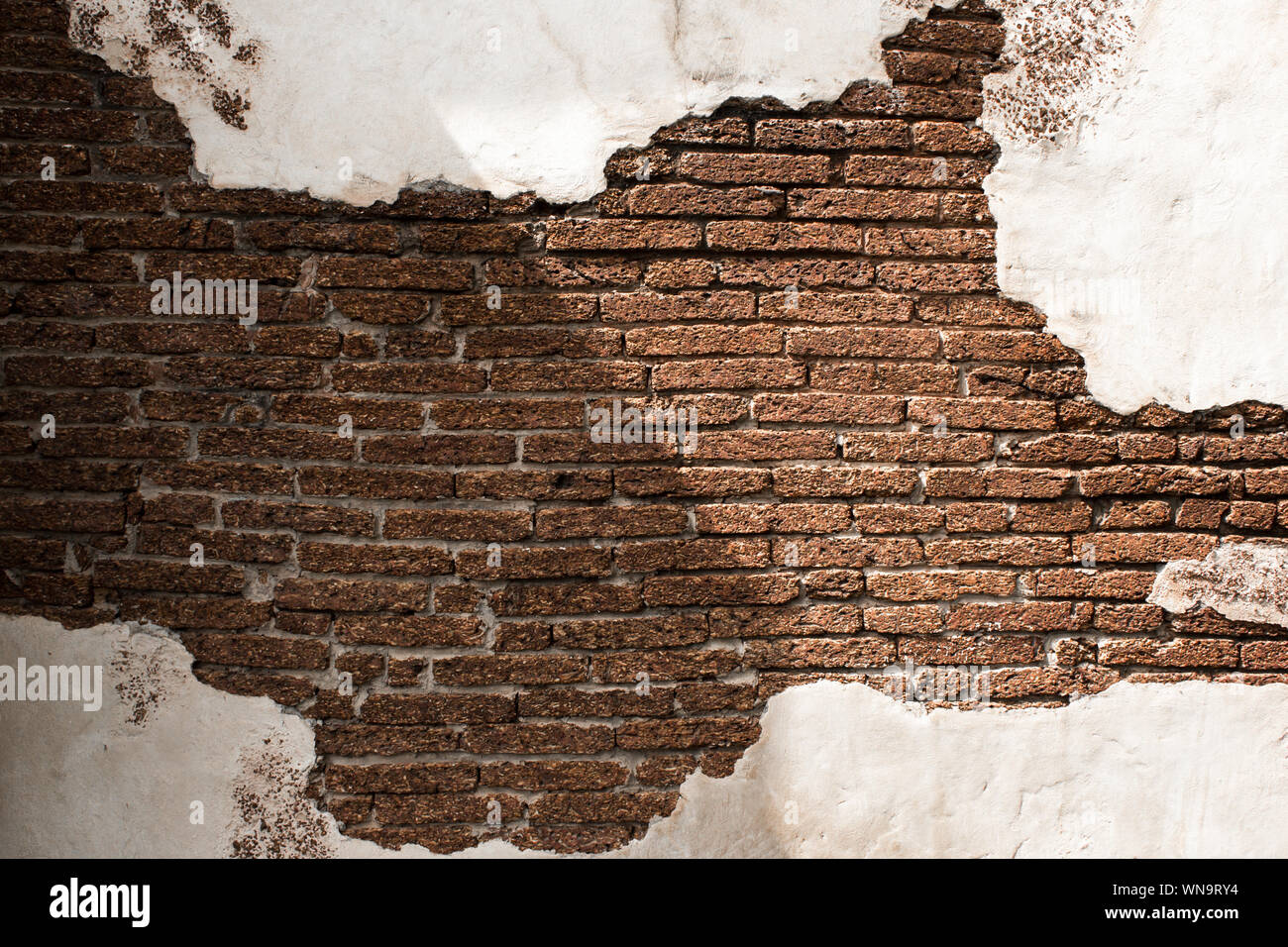 Contexte et structure des murs blancs et de brique antique brown. Banque D'Images