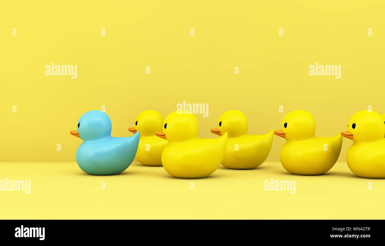 Concept de leadership : jaune canards en caoutchouc avec rendu 3D leader bleu Banque D'Images