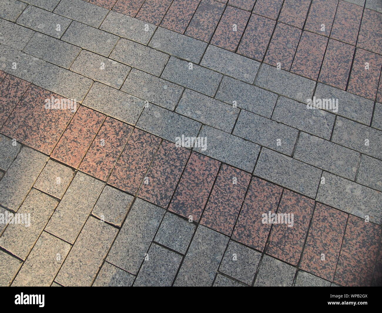 Pavés granit jeté sur la route. Trottoir. Photo de fond. Banque D'Images