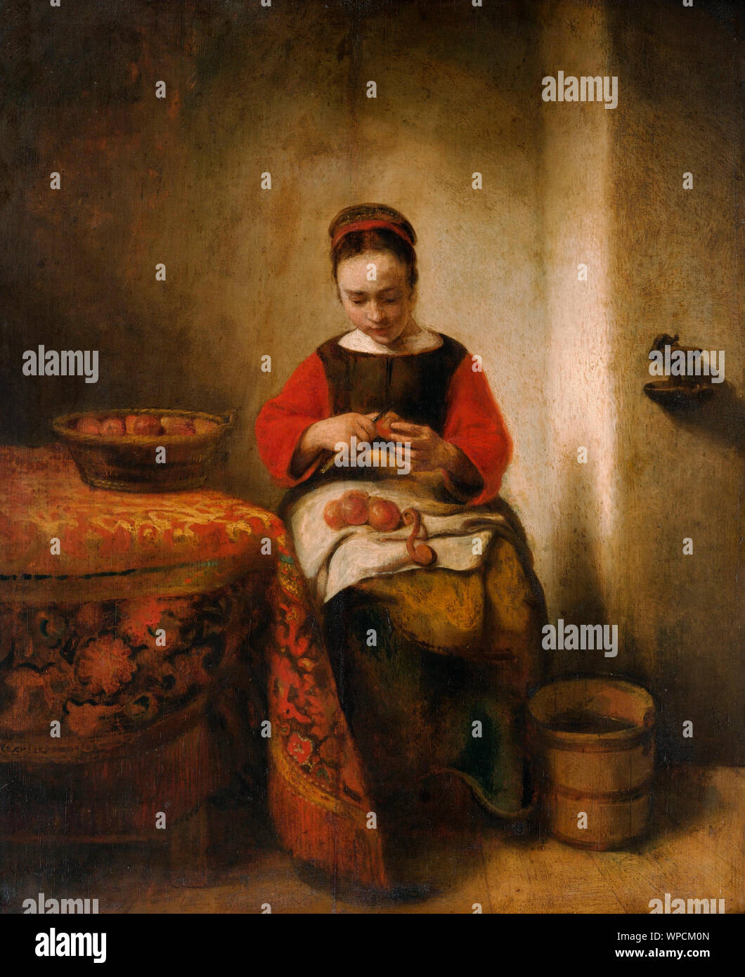 Young Woman Peeling Apples - Nicolaes MAES, vers 1650 Banque D'Images