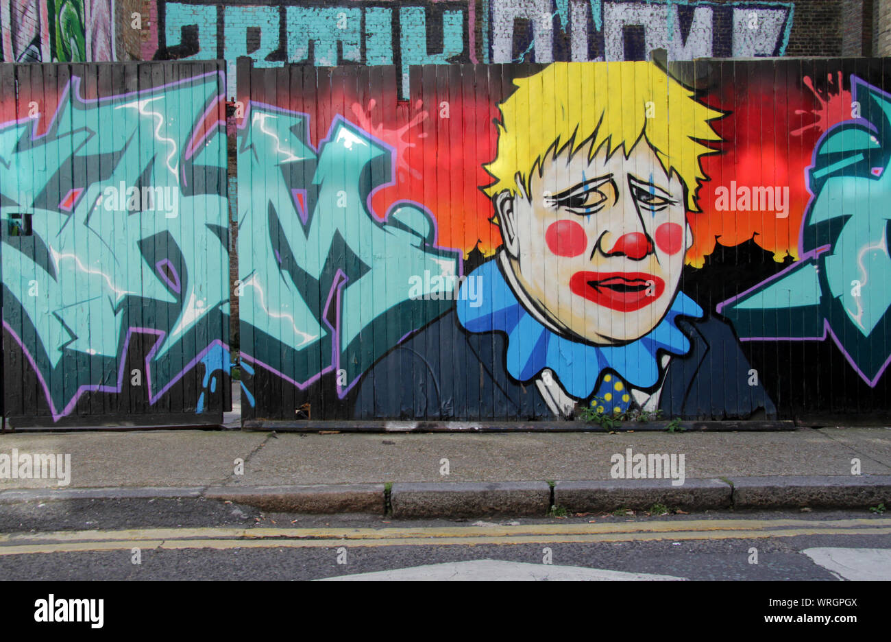Brick Lane, Londres, Royaume-Uni - 10 septembre 2019 : Boris Johnson décrit comme un clown par graffiti artistes est de Londres. Banque D'Images