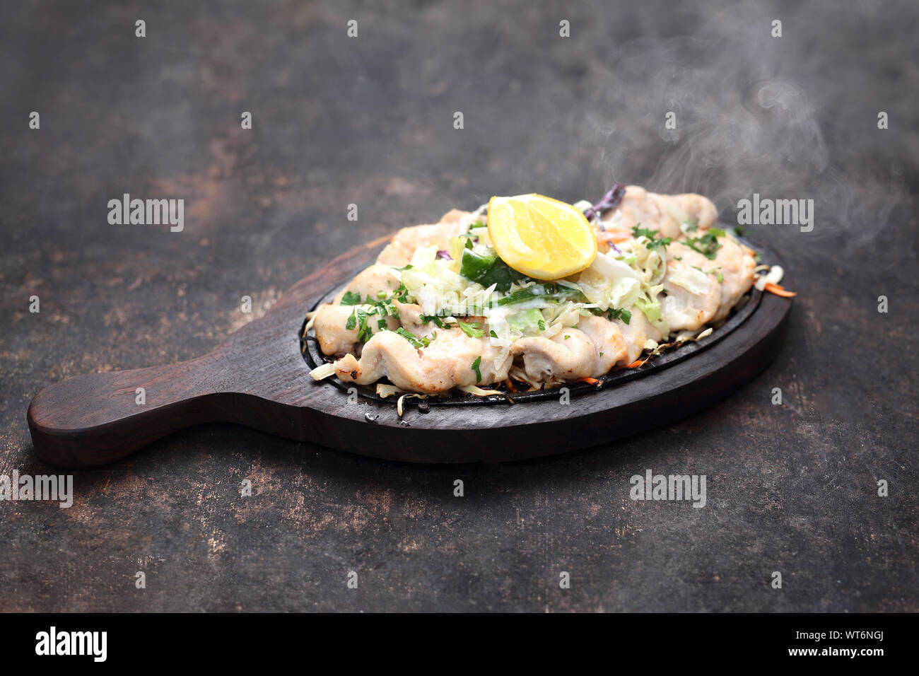 Malai tikka de poulet sur un plat chaud Banque D'Images