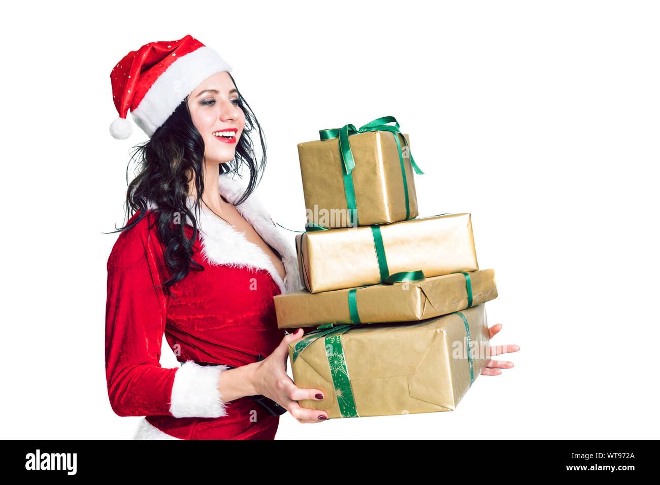 Santa girl de jeunes curieux, Noël hat holding box avec don présent sur isolé sur fond blanc. Bonne année fête vacances partie concep Banque D'Images