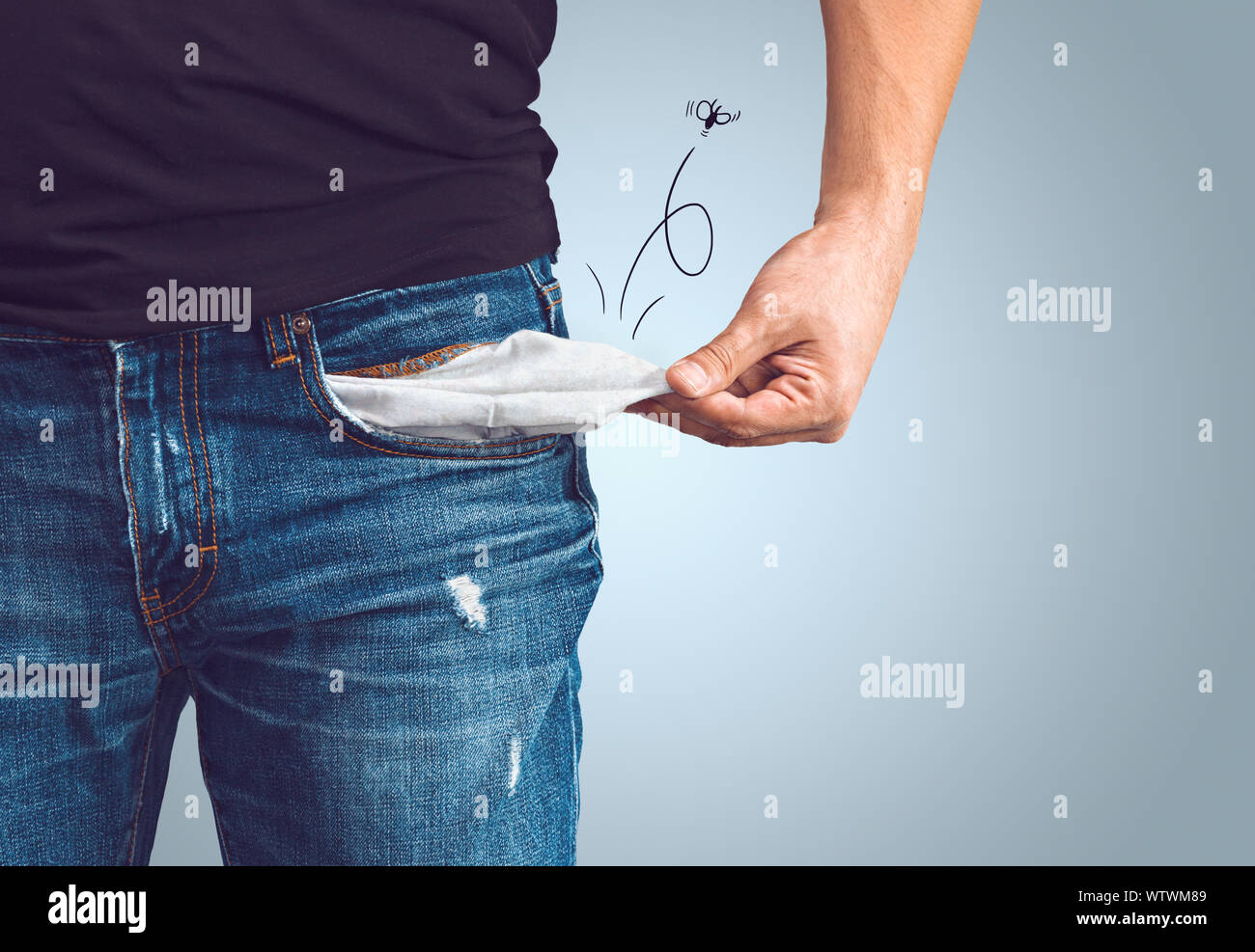 Pauvre homme en jeans avec poche vide et dessiné concept fly Banque D'Images