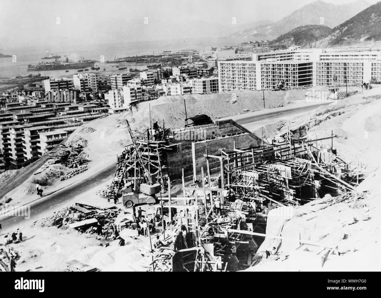 Site de construction routière, Kowloon, Hong Kong, 1960 Banque D'Images