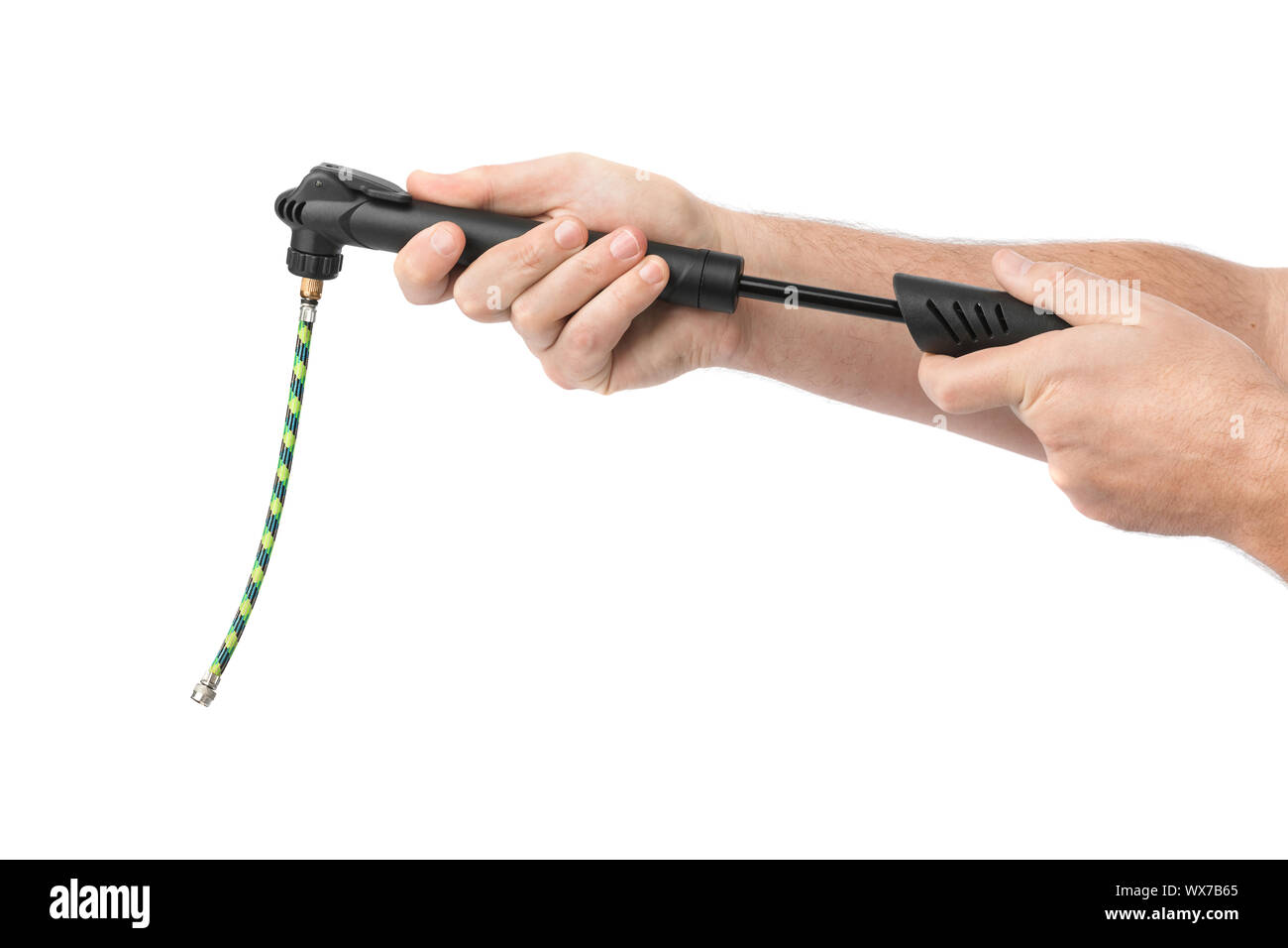 Les mains avec pompe à vélo Banque D'Images