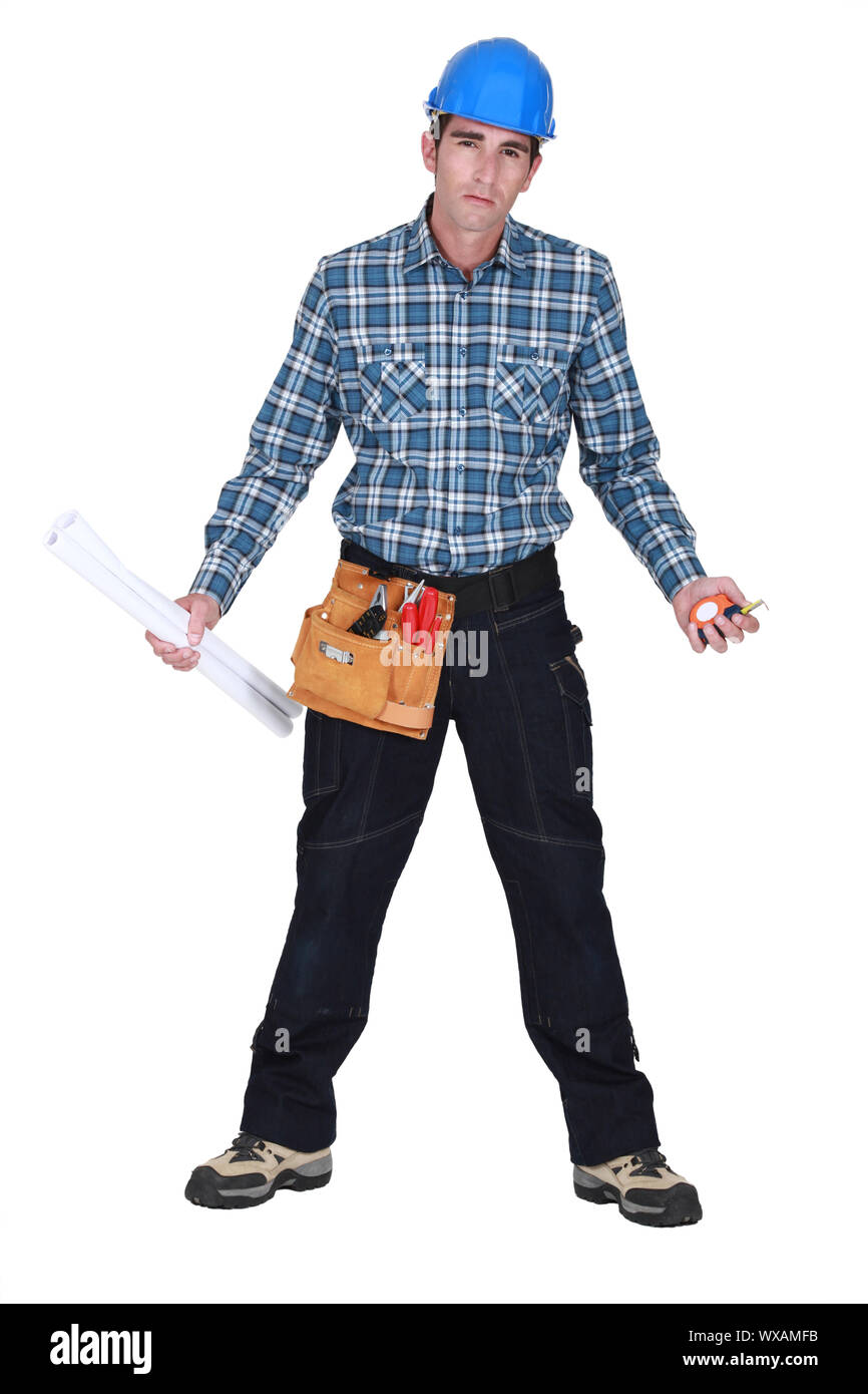 Malheureux commerçant tenant ses outils et les dessins Banque D'Images