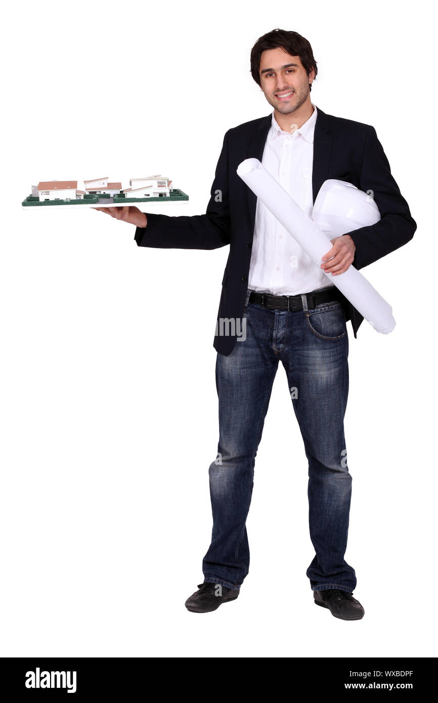 Architect holding blueprint enroulé un Banque D'Images