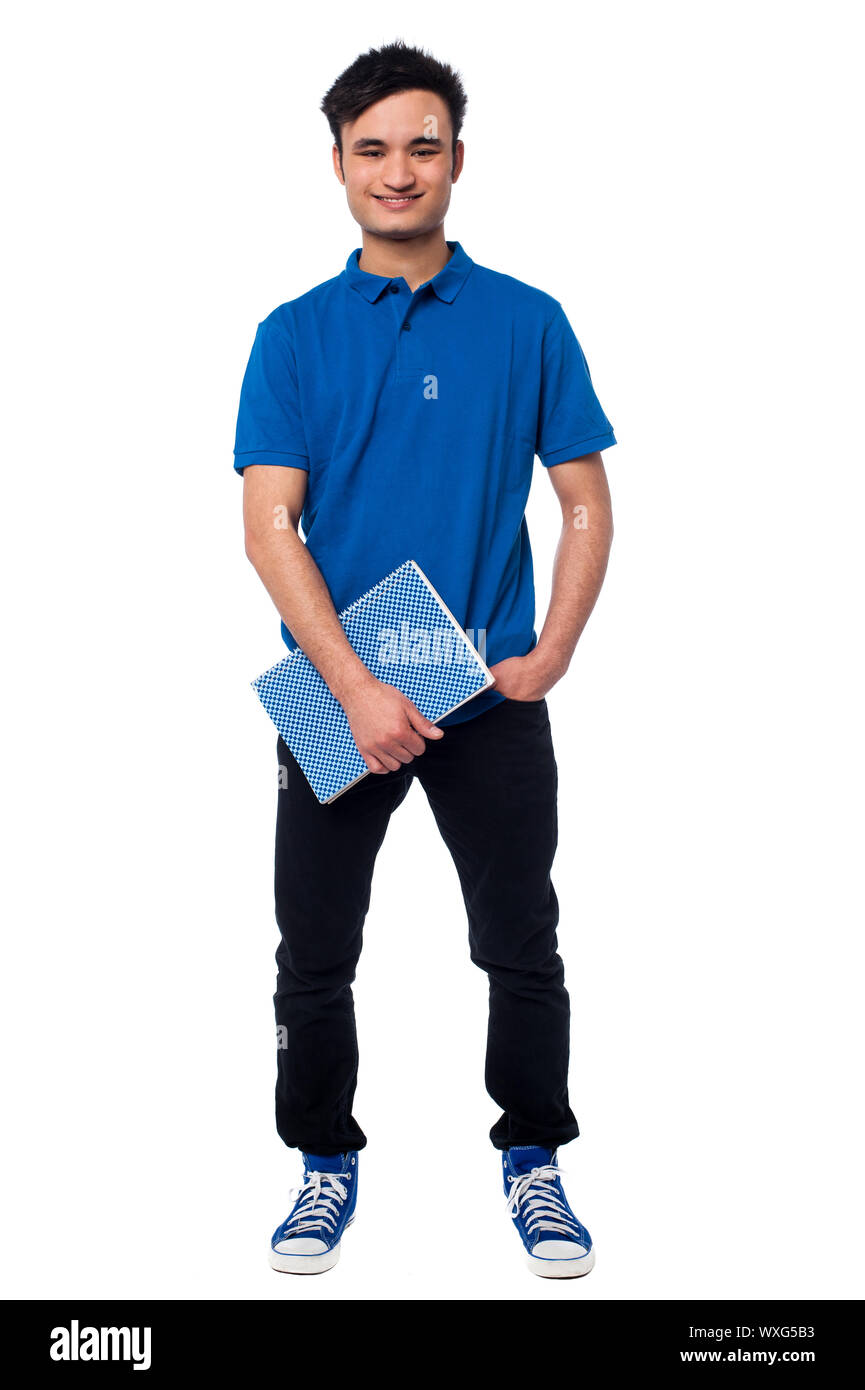 Cheerful college student holding notebook Banque D'Images